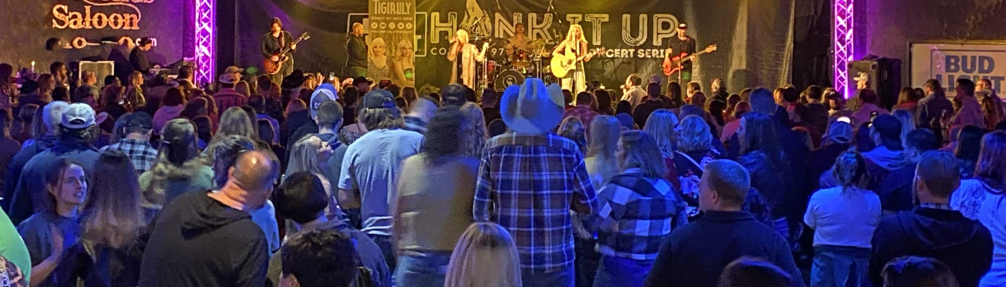 country concert with fans wearing cowboy hats Dayton